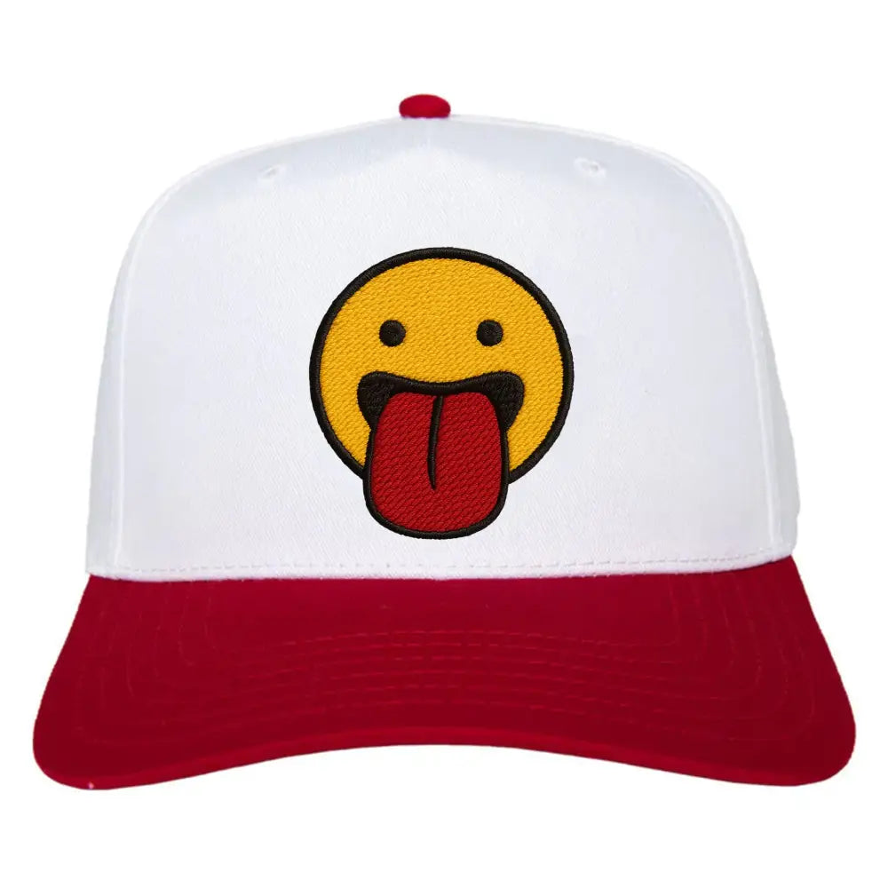 White and red cap featuring a smiling emoji with its tongue sticking out, representing fun and playful style.